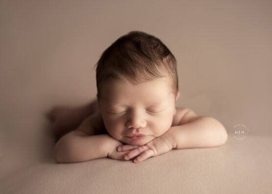 troy michigan newborn photographer melissa anne photography neutral baby with hair forward facing pose