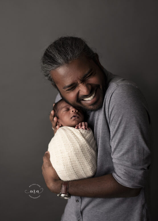 Troy Michigan newborn photographer Melissa Anne Photography dad with baby