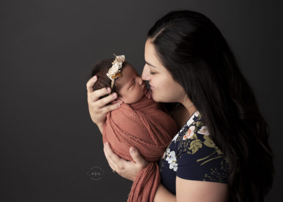 Troy Michigan newborn photographer Melissa Anne Photography mom with baby wrapped