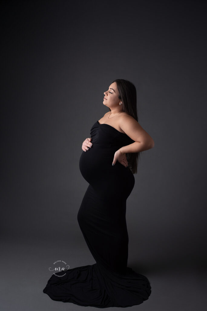 Michigan maternity newborn photographer Melissa Anne Photography black gown in studio elegant photo session