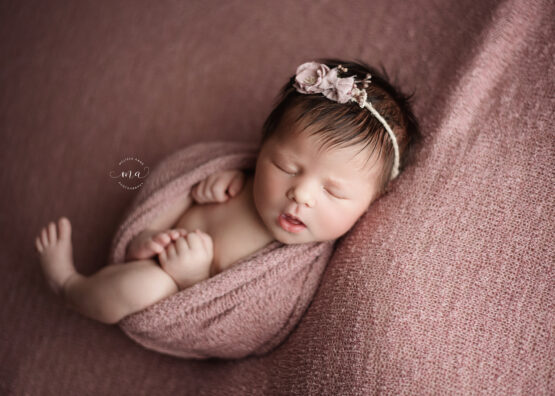 Michigan newborn photographer Melissa Anne Photography baby girl pink Huck Finn pose