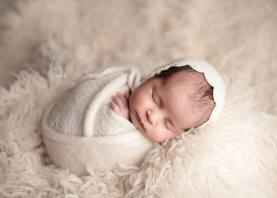 Michigan newborn photographer Melissa Anne Photography fallen potato sack pose neutrals baby girl with bonnet
