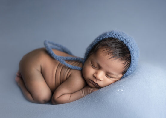 Michigan newborn photographer Melissa Anne Photography tushie up pose baby boy with bonnet
