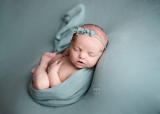 Michigan newborn photographer Melissa Anne Photography wrapped Huck Finn pose