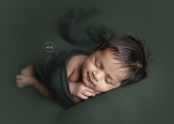 Michigan newborn photography Melissa Anne Photography wrapped dark green baby boy with dark hair