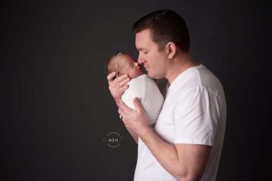 Michigan newborn photographer Melissa Anne Photography Dad with new baby