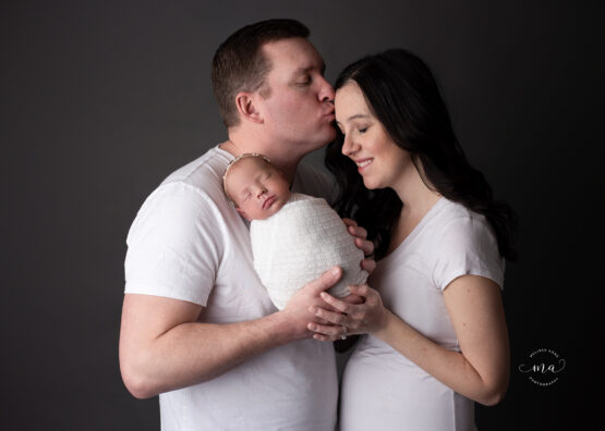 Michigan newborn photographer Melissa Anne Photography mother and father with new baby