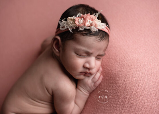 Michigan newborn photographer Melissa Anne Photography baby girl side lay pose