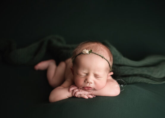 Michigan newborn photographer Melissa Anne Photography forward facing baby girl hunter green