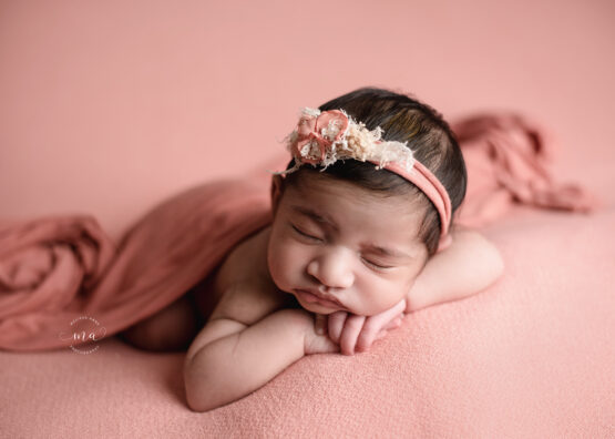 Michigan newborn photographer Melissa Anne Photography forward facing pose coral baby girl