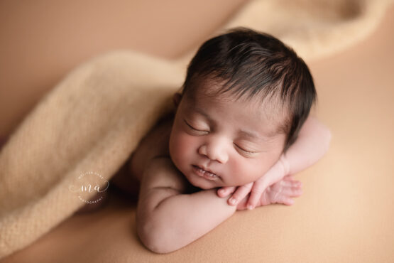 Michigan newborn photographer Melissa Anne Photography forward facing pose yellow