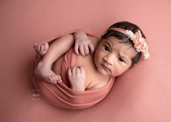 Michigan newborn photographer Melissa Anne Photography Huck Finn wrapped coral baby girl