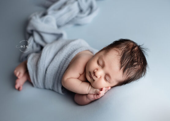 Michigan newborn photographer Melissa Anne Photography side lay baby boy with dark hair