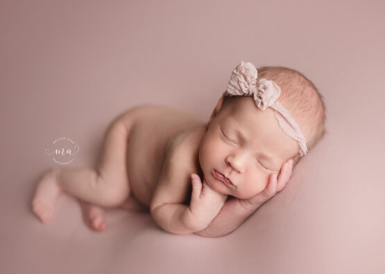 Michigan newborn photographer Melissa Anne Photography side lay pose baby girl pink