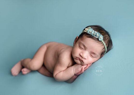 Michigan newborn photographer Melissa Anne Photography side lay pose robin egg blue