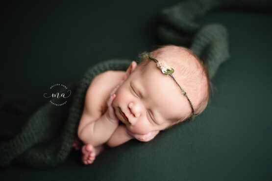 Michigan newborn photographer Melissa Anne Photography timber pose baby girl hunter green