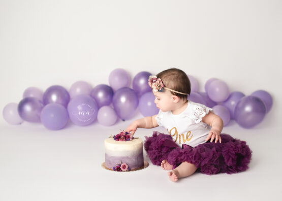 cake smash photographer Melissa Anne Photography purple with white naked cake with flowere
