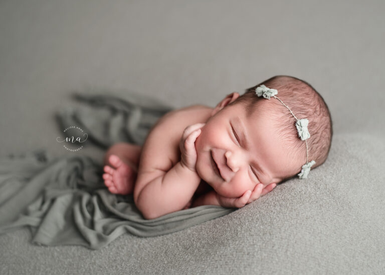 Michigan newborn photographer Melissa Anne Photography timber pose smiling newborn baby girl