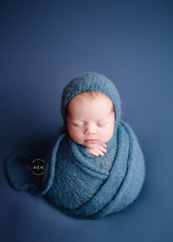 Michigan newborn photographer Melissa Anne Photography baby boy blue wrap potato sack pose