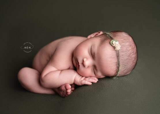 Michigan newborn photographer Melissa Anne Photography taco pose womb pose hunter green