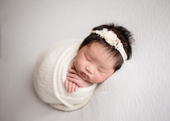 Michigan newborn photographer Melissa Anne Photography wrapped baby girl with lots of hair