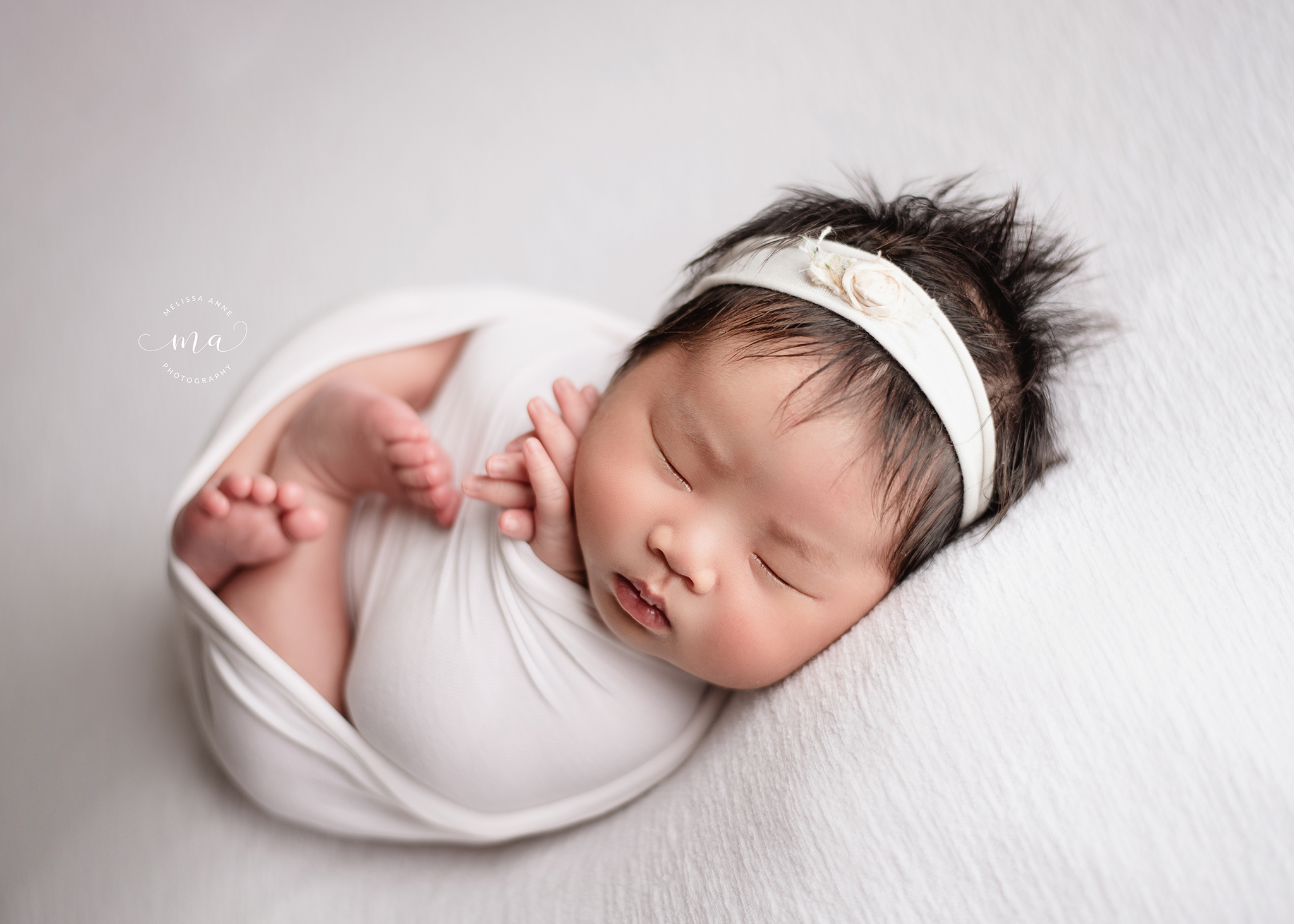 michigan newborn photographer melissa anne photography wrapped pose baby girl