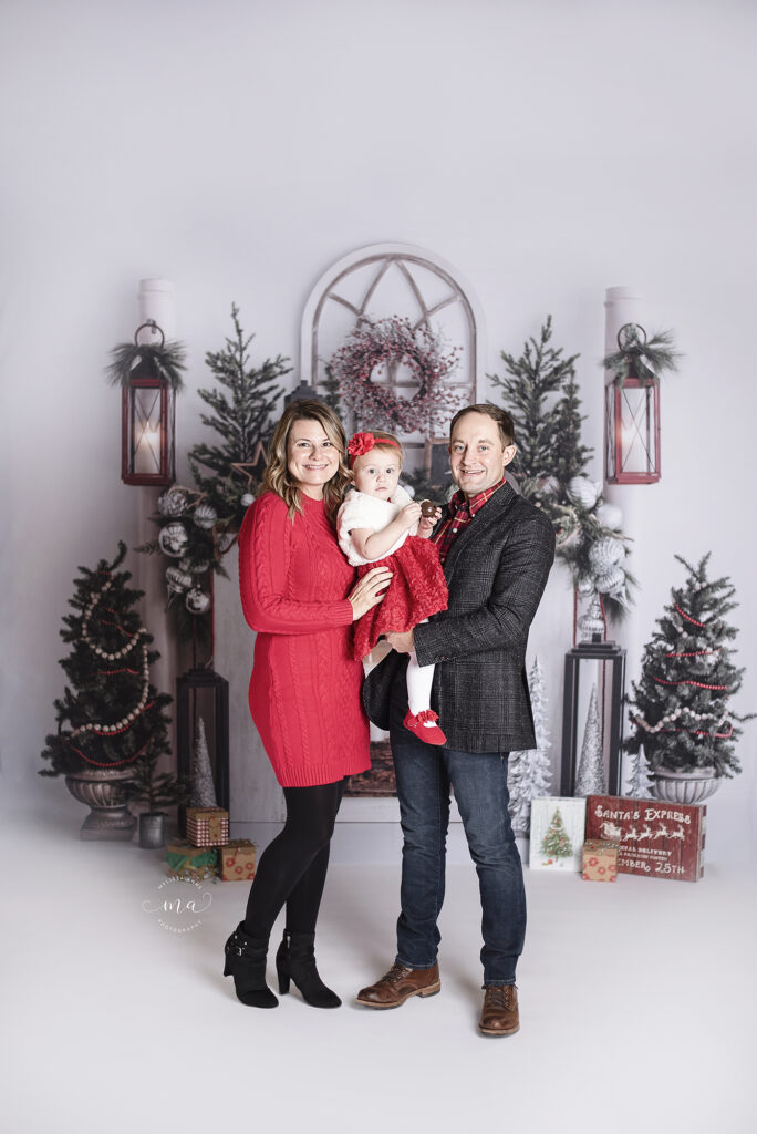 Troy Michigan photographer Melissa Anne Photography Christmas session family on white fireplace scene