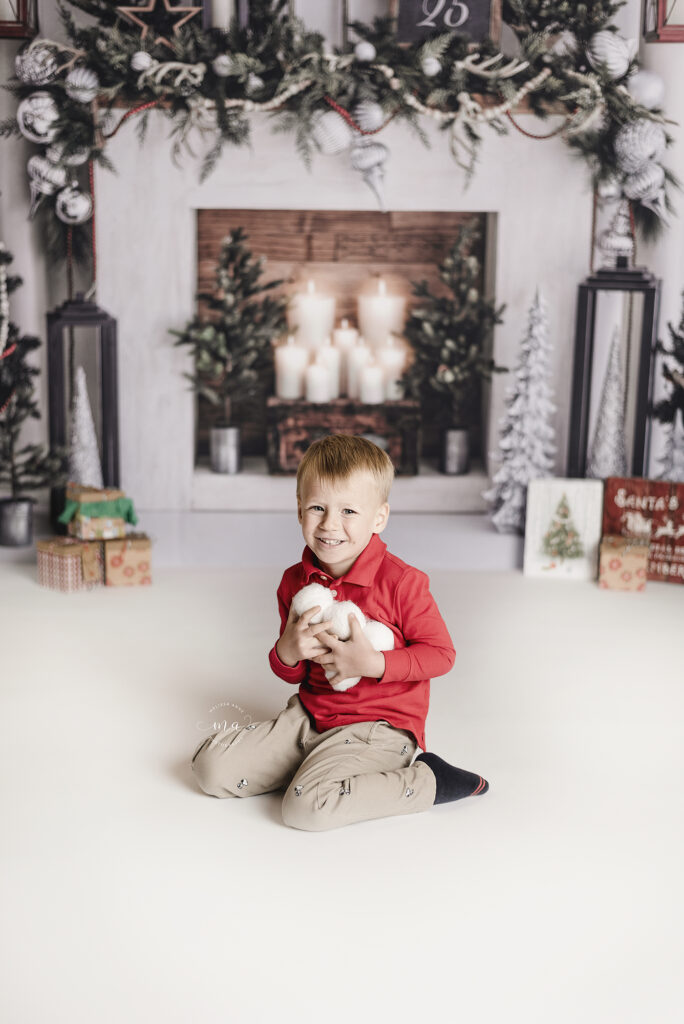 Troy Michigan photographer Melissa Anne Photography little boy with snowballs fireplace scene