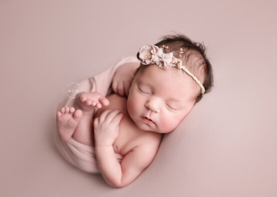 Troy Michigan newborn photographer Melissa Anne Photography baby girl Huck Finn pose on pink