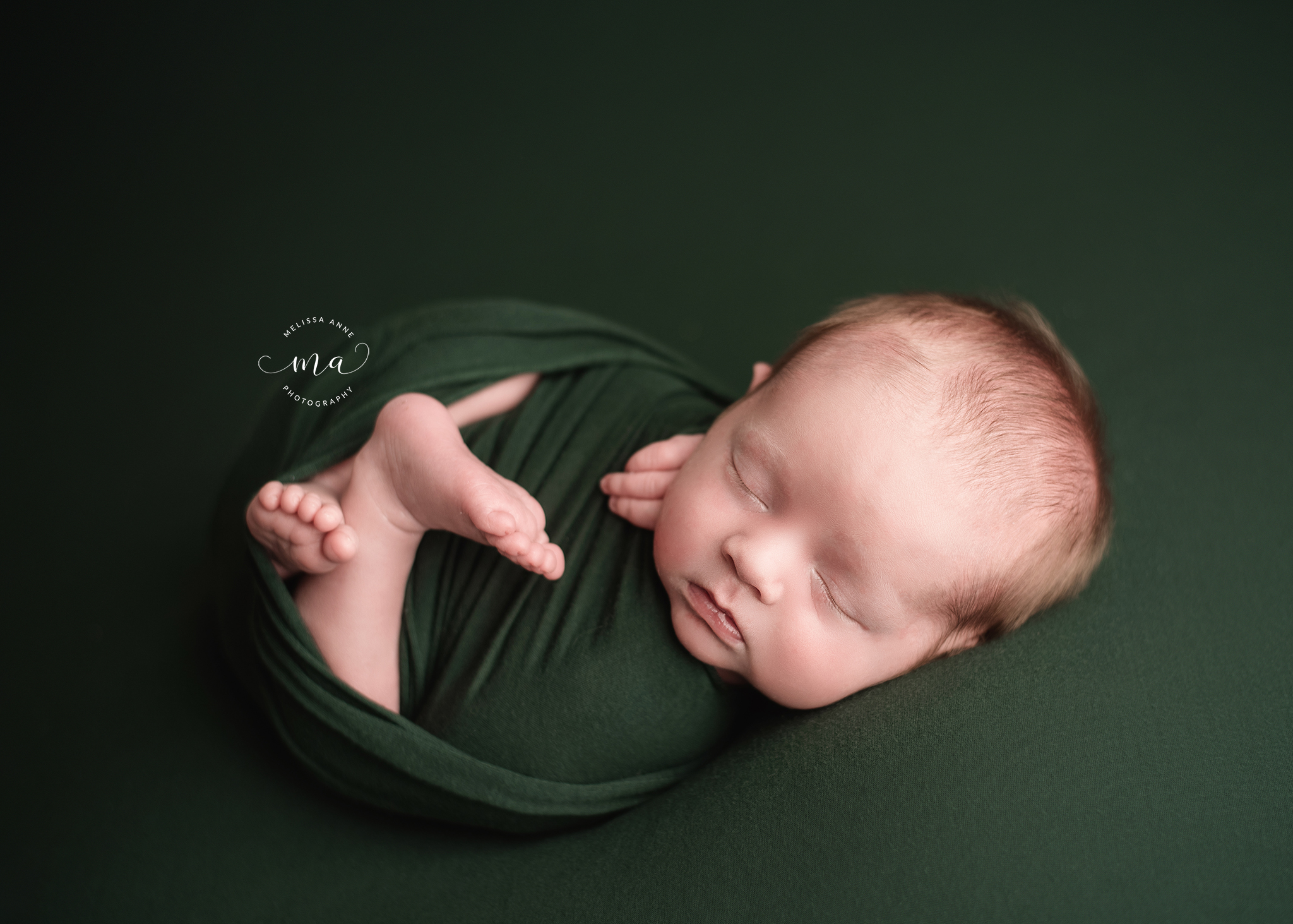 Michigan newborn photographer Melissa Anne Photography Huck Finn pose with baby boy green wrap