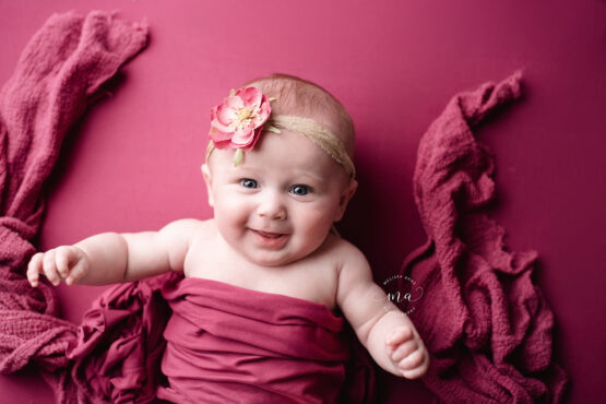 Michigan newborn photographer Melissa Anne Photography milestone session with girl smiling four months old