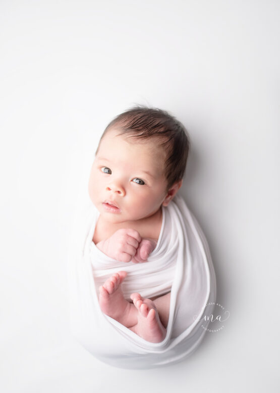 Michigan newborn photographer Melissa Anne Photography baby boy wrapped in white