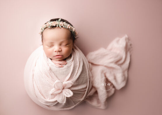 Michigan newborn photographer Melissa Anne Photography flower wrap pose with baby girl with dark hair