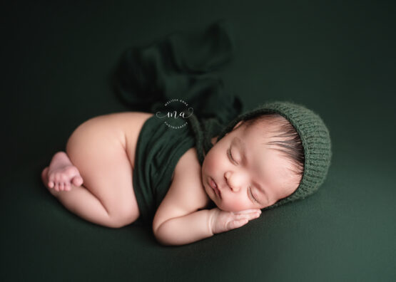 Michigan newborn photographer Melissa Anne Photography tushie up pose with baby boy with bonnet