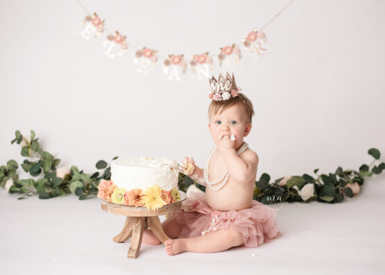 Michigan photographer Melissa Anne Photography cake smash photo session with flowers rose gold