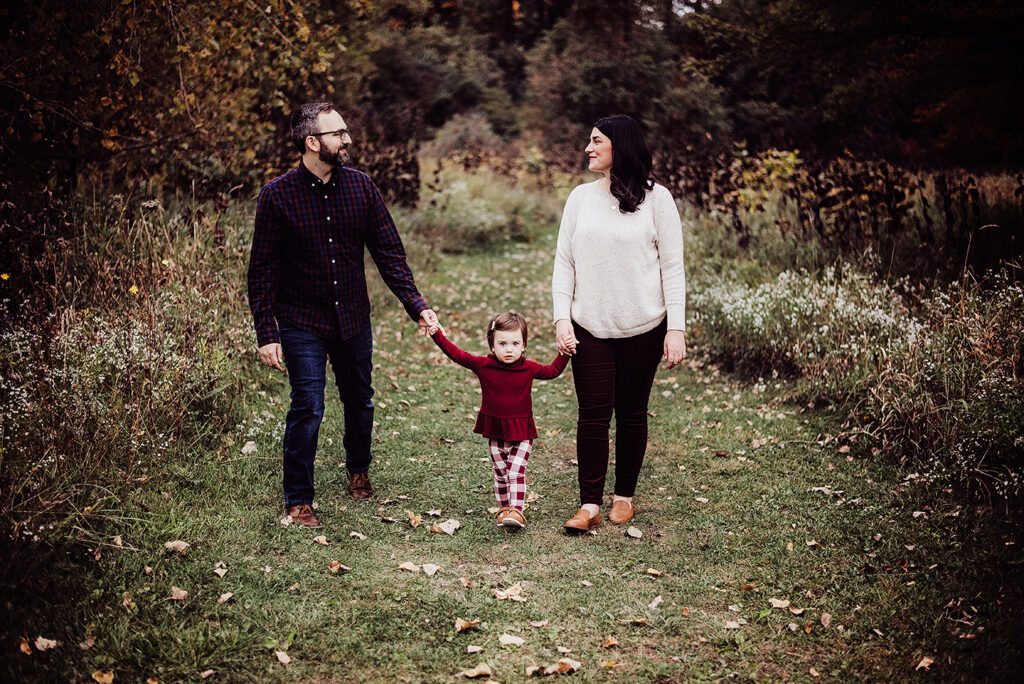 metro Detroit family photographer Melissa Anne Photography family photo in park holding hands and walking