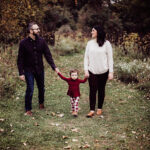 metro Detroit family photographer Melissa Anne Photography family photo in park holding hands and walking