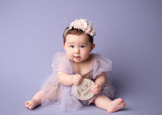 Metro Detroit Photographer Melissa Anne Photography six month old girl in purple with headband