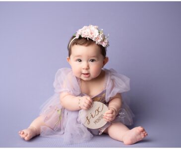 Metro Detroit photographer Melissa Anne Photography six month old girl in purple with headband
