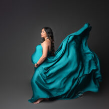 Metro Detroit maternity photographer Melissa Anne Photography pregnancy studio photo with green scarf flowing