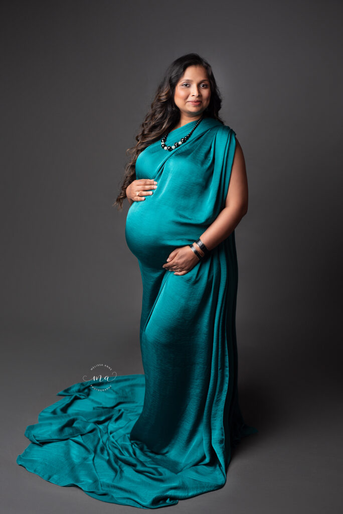 Metro Detroit maternity photographer Melissa Anne Photography pregnant mother to be in emerald gown with long dark hair