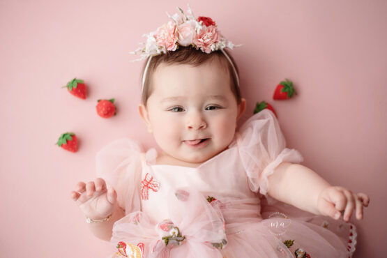 Metro Detroit photographer Melissa Anne Photography six month old milestone photos with girl with strawberries