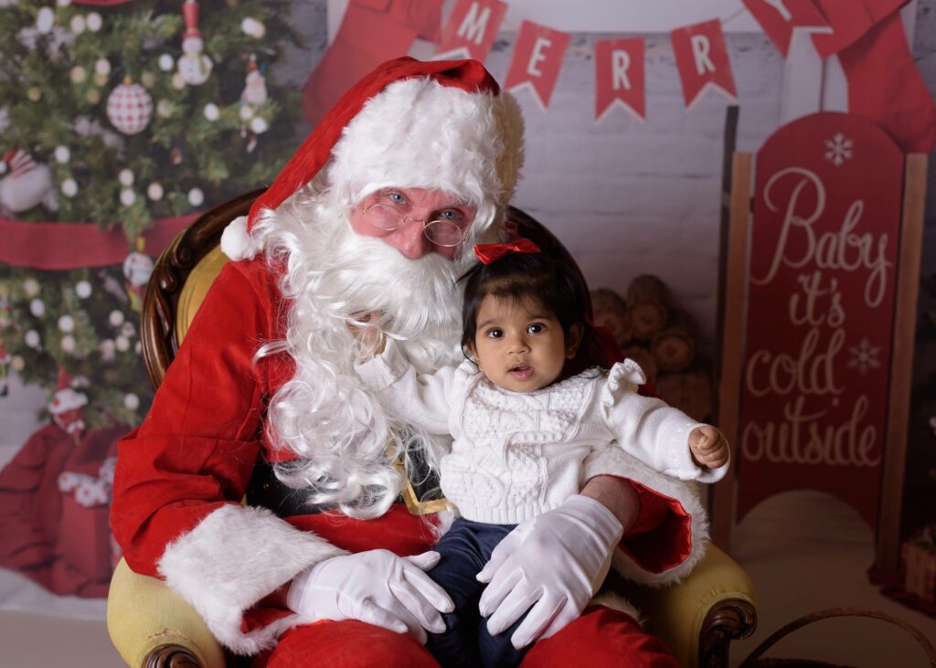 Michigan photographer Melissa Anne Photography little girl sitting on Santas lap