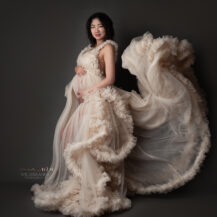 Troy Michigan maternity photographer Melissa Anne Photography luxury maternity photo session in studio with mother to be wearing custom made tulle ball gown
