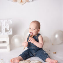Troy Michigan photographer Melissa Anne Photography cake smash photo in studio with one year old boy