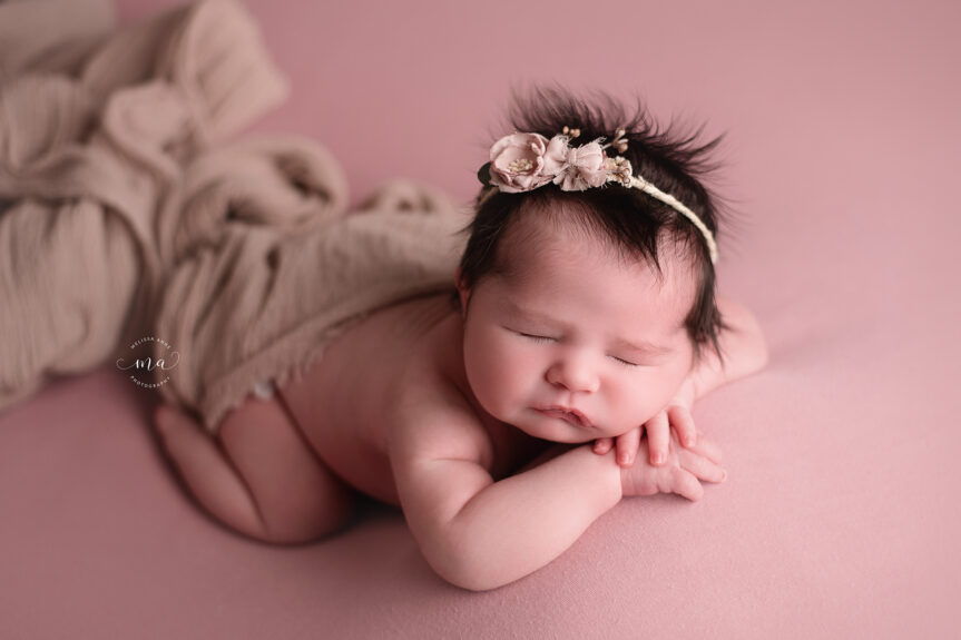 West Bloomfield Michigan newborn photographer Melissa Anne Photography newborn baby girl forward facing with floral headband