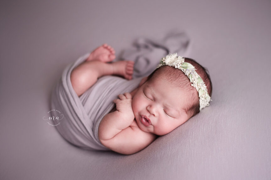 Birmingham Michigan newborn photographer Melissa Anne Photography baby girl wrapped in purple wrap