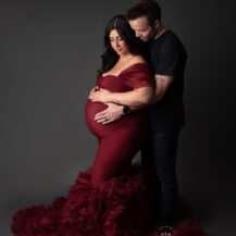 Clarkston Michigan maternity photographer Melissa Anne Photography studio maternity photo session with red couture gown