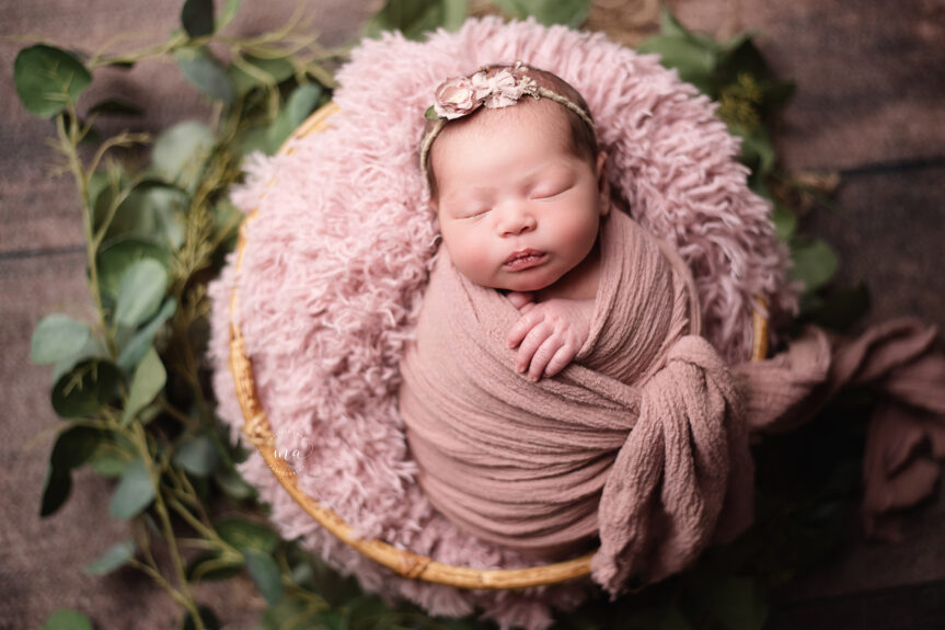 Holly Michigan newborn photographer Melissa Anne Photography baby girl wrapped in pink in round bamboo basket