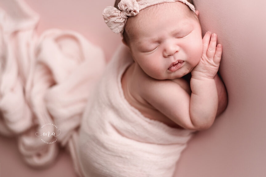 St Clair Shores Michigan newborn photographer Melissa Anne Photography baby girl with flowy pink wrap and headband